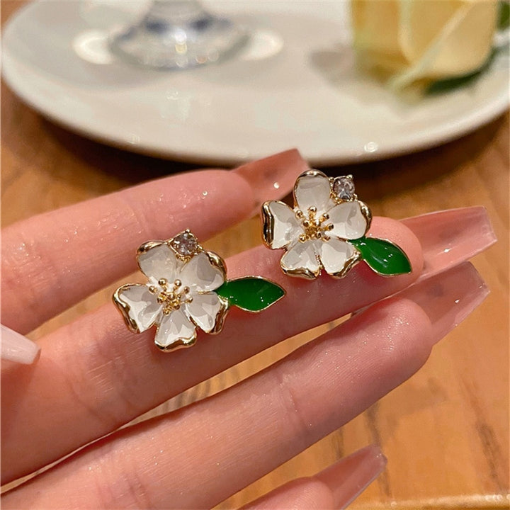 White Flower Clip on Earrings